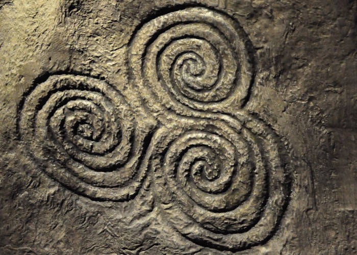 This is an image of three spirals carved into stone.