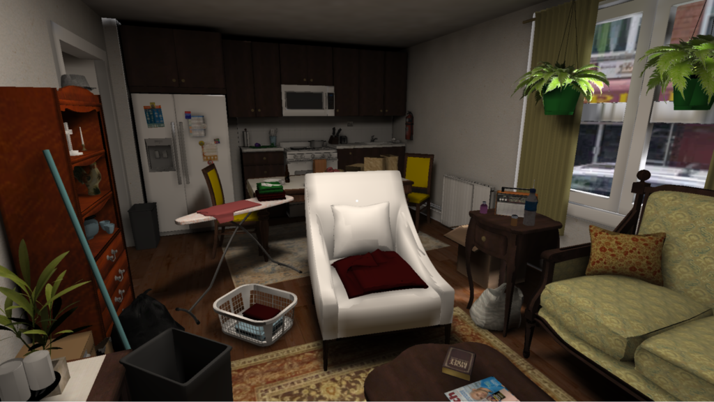 The image shows an open concept kitchen and living room area. A refrigerator, stove and cabinets are seen in the kitchen area. A sofa, recliner chair, bookshelves and plants are seen in the living room area. The room is purposely cluttered with books, laundry and cleaning items.