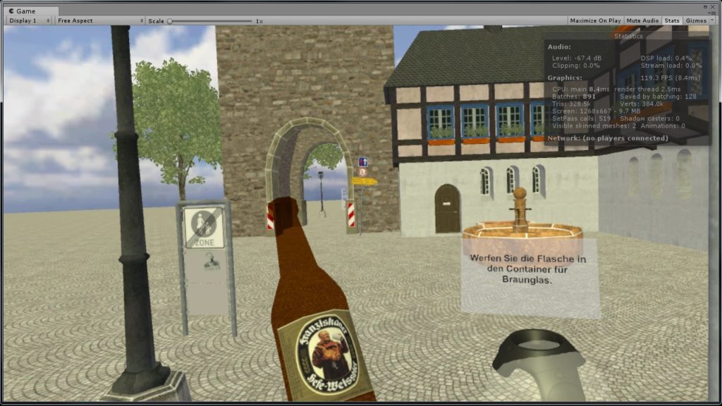 Screen capture from the German VR project showing a German public space, a beer bottle, and a VR hand controller with directions in German.