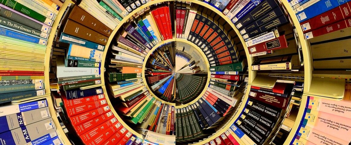 A spiral of books on library shelves appears almost as though a pie chart.