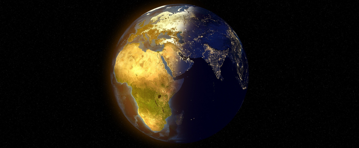 Earth viewed from space, with Africa lit up in the sun.