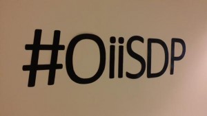 Figure 2. Hashtag wall-art photo by Homero Gil de Zuniga. Wall stickers spelling out the conference hashtag: #OiiSDP