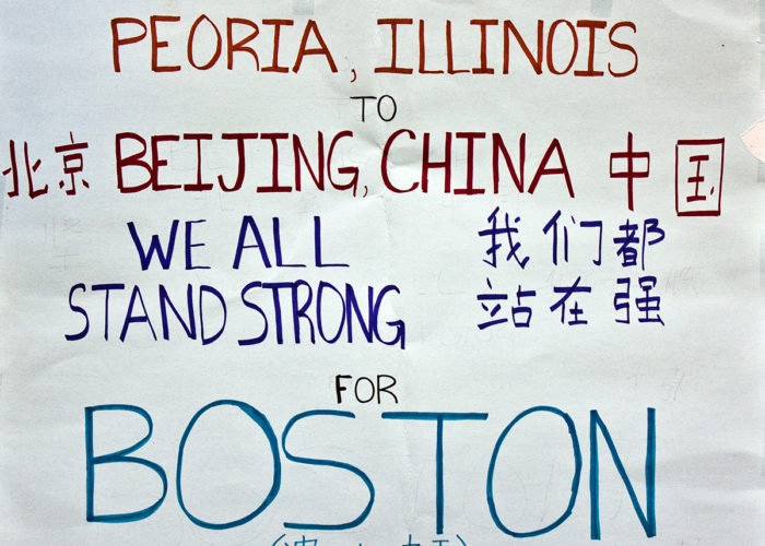 Figure 1. Digital image of a poster left at the Boston Marathon memorial in Copley Square. The poster reads “From Peoria Illinois to Beijing China, we all stand strong for Boston” in both English and Chinese (http://hdl.handle.net/2047/D20262219).