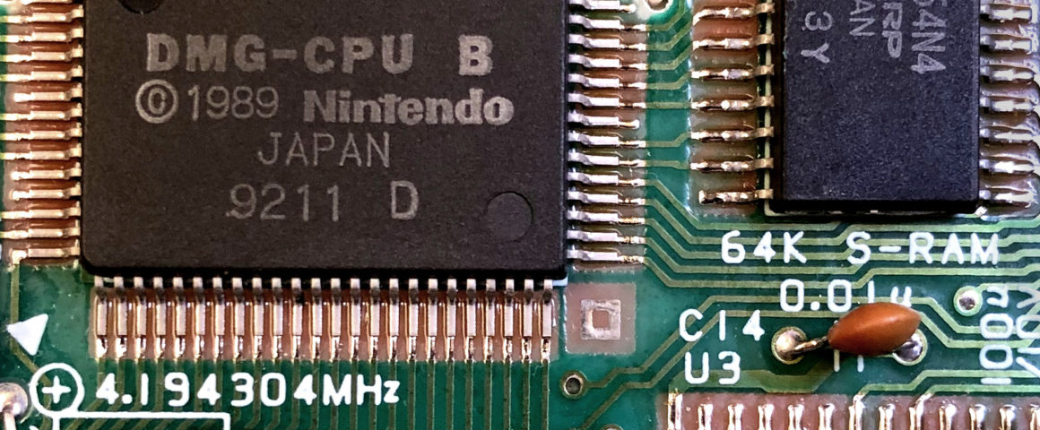A closeup of a circuit board with several visible chips.